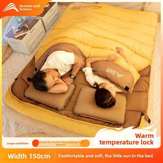 A thick portable sleeping bag for double camping to keep warm in winter