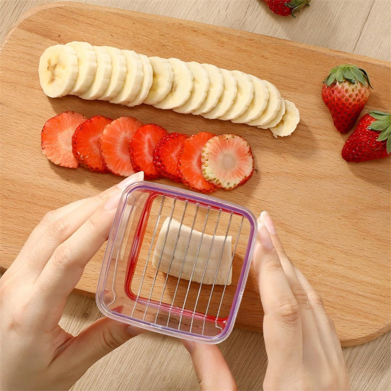 Quick slicing of fruits in the kitchen with a pusher
