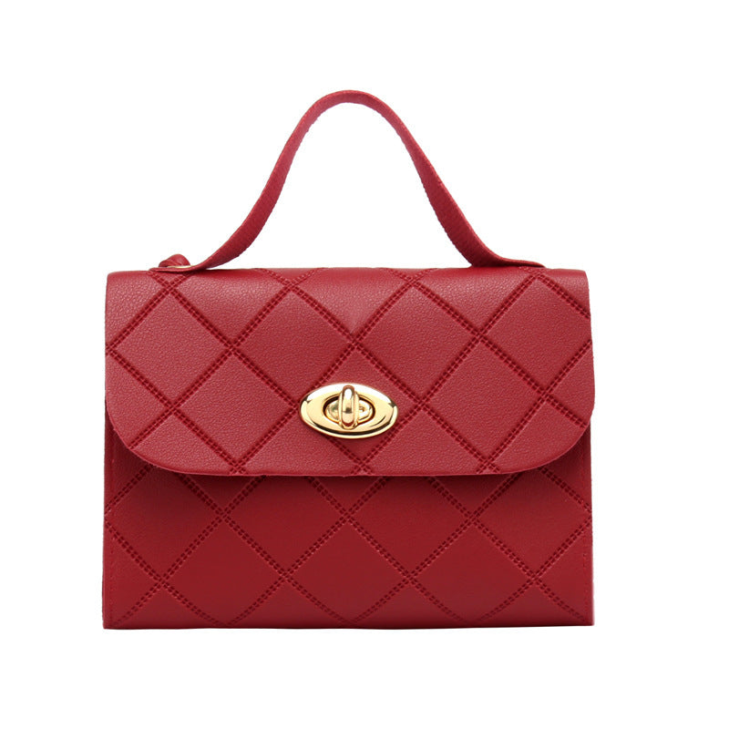 A small square bag with diamond-shaped stripes