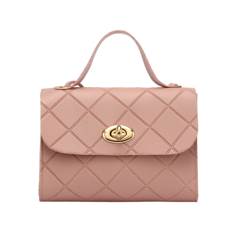 A small square bag with diamond-shaped stripes