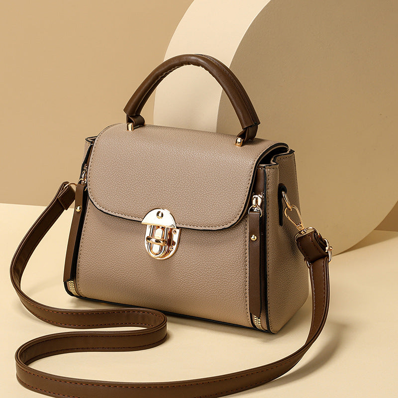 A large-capacity hand-held crossbody bag with a lock