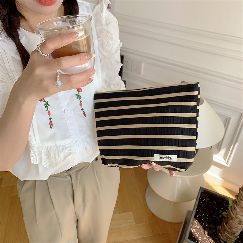 Knitted striped makeup bag