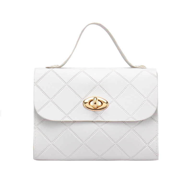 A small square bag with diamond-shaped stripes