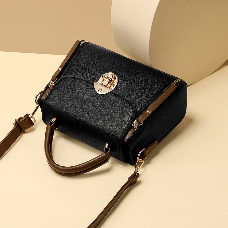A large-capacity hand-held crossbody bag with a lock