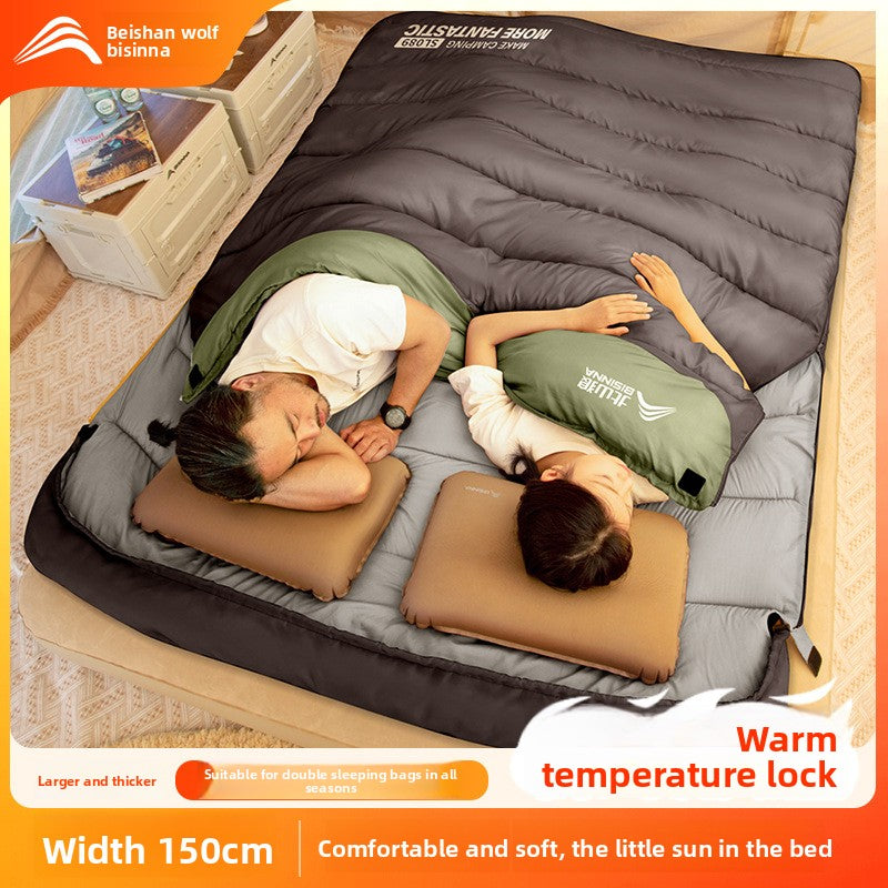 A thick portable sleeping bag for double camping to keep warm in winter