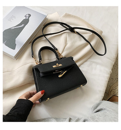 Carry a Kelly bag diagonally over one shoulder
