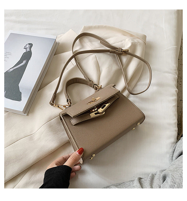 Carry a Kelly bag diagonally over one shoulder