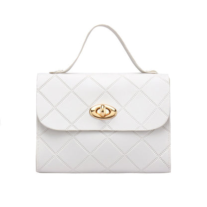 A small square bag with diamond-shaped stripes