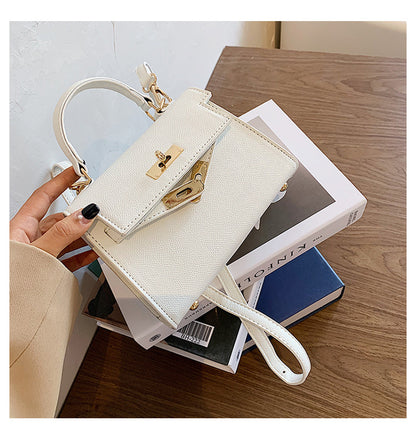 Carry a Kelly bag diagonally over one shoulder