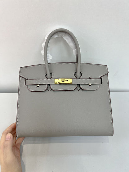 Outer sewn commuter single-shoulder handbag
